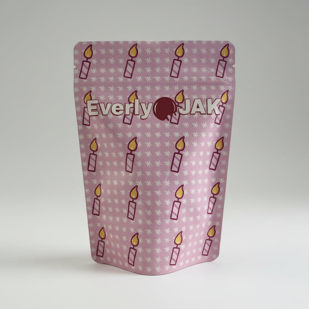 Product packaging with 'Everly Jak' branding and candle illustrations on a white background