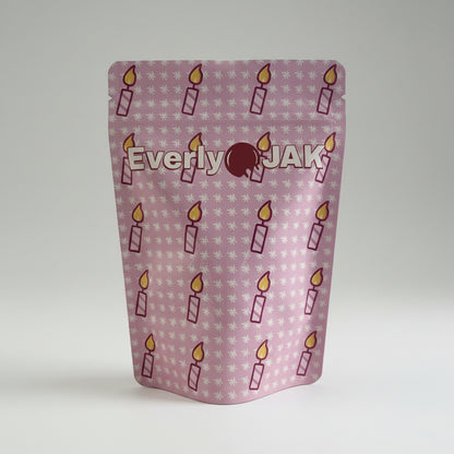 Product packaging with 'Everly Jak' branding and candle illustrations on a white background
